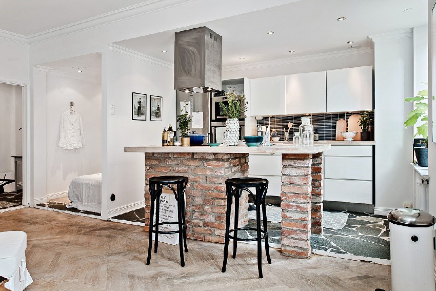 one-room Scandinavian apartment brick kitchen island