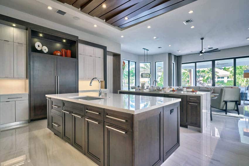 Open plan contemporary kitchen with two islands and attached living room