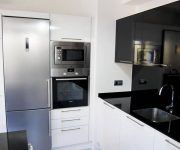 High tech kitchen design idea – white and black colors