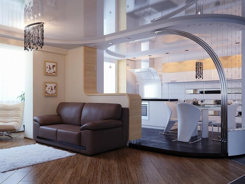 Около барной стойки, отделяющей зону кухни от гостиной, можно расположить диван. Такой дизайн прост и удобен