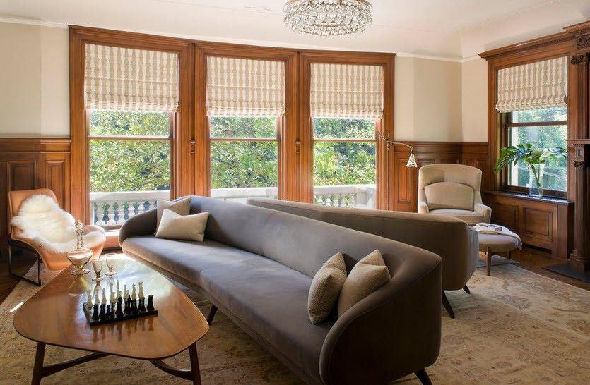 Подбирая серый диван, обязательно следует учитывать дизайн гостиной