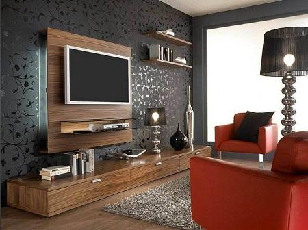 Оформлять стену под телевизор следует таким образом, чтобы она гармонично вписывалась в общий стиль помещения 