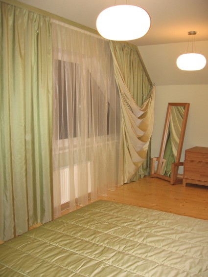 green non standard window curtains in bedroom