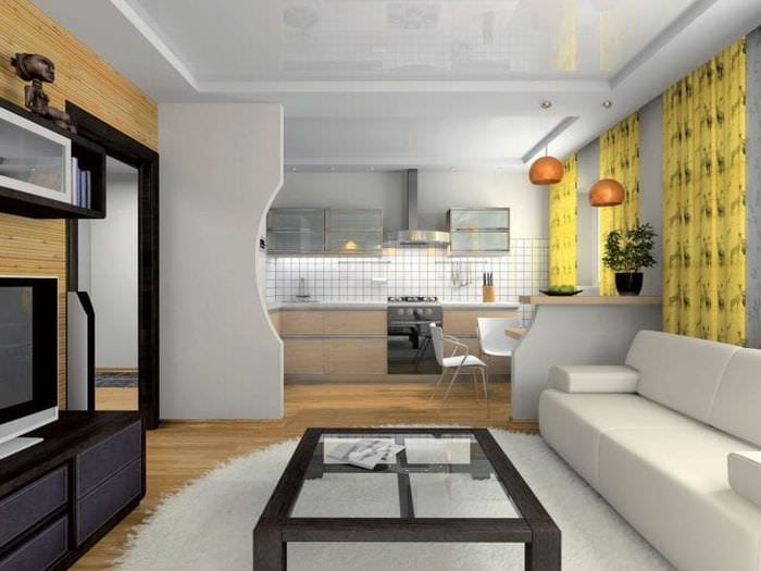 Дизайн большой и светлой комнаты с рабочими зонами для кухни и столовой 